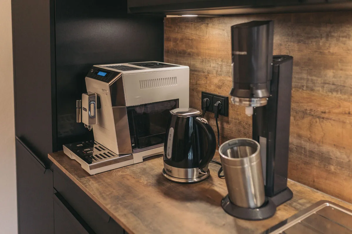 Coffee machine, kettle and water carbonator in the kitchen
